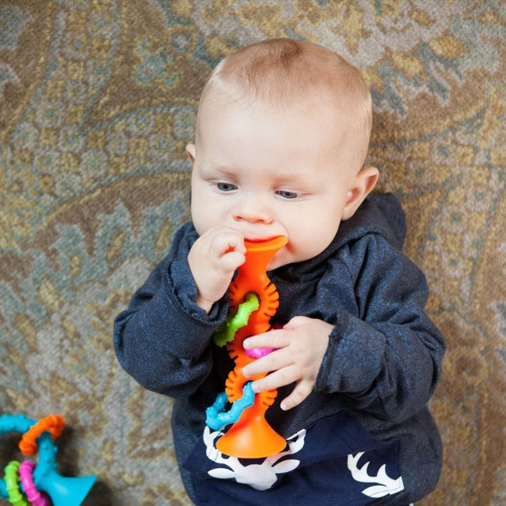 Bebés y niños pequeños Mordedor y Sonajero Sensorial, Pipsquigz Loops Naranjo Fat Brain Toys 811802021922